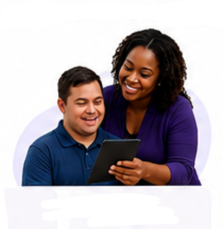 A caregiver and the person she supports smiling together while using a tablet